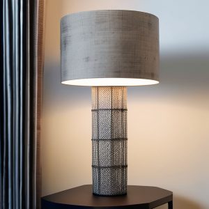 an oversized lamp on a black table