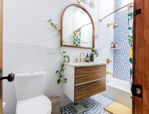 white ceramic toilet bowl on patterned bathroom tile