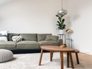 brown wooden coffee table inside a Scandinavian apartment