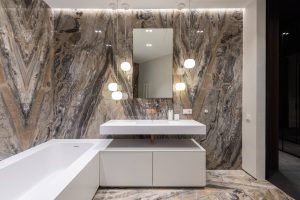 a bathroom with detailed marble walls and floors
