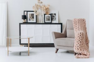 a minimalistic interior with a beige sofa near a table